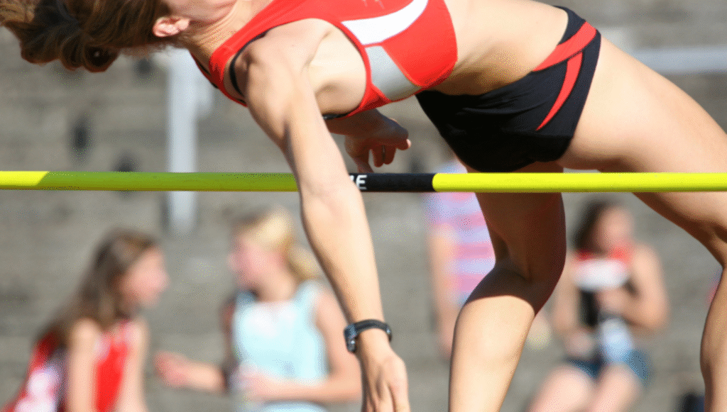 Female high Jump over the bar close up